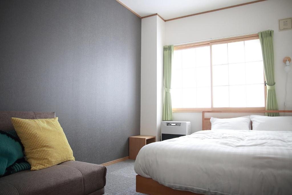 Postel nebo postele na pokoji v ubytování THE STAY WAKKANAI