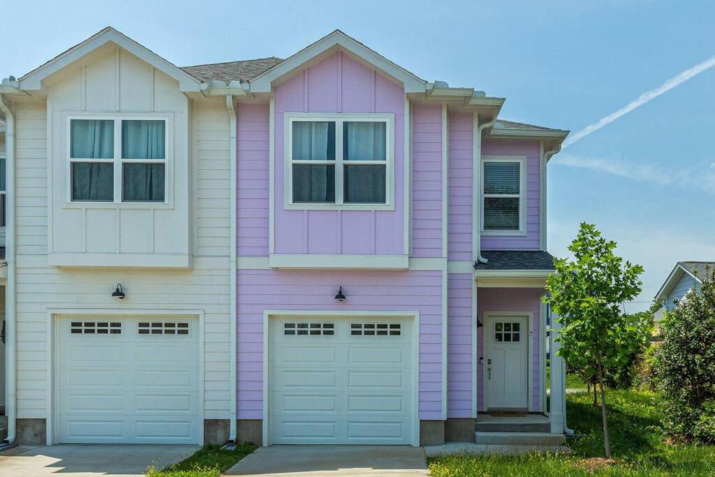 a pink house with two garage doors at #BestStayEverNashville in Nashville