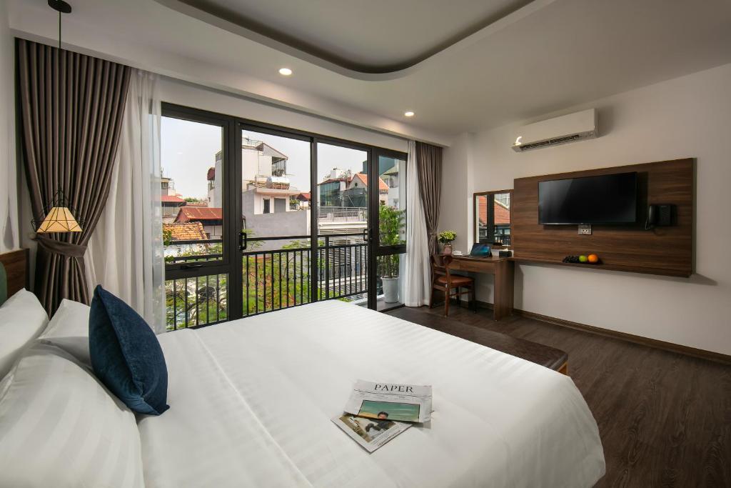 Postel nebo postele na pokoji v ubytování Hanoi Vacanza Premier Hotel