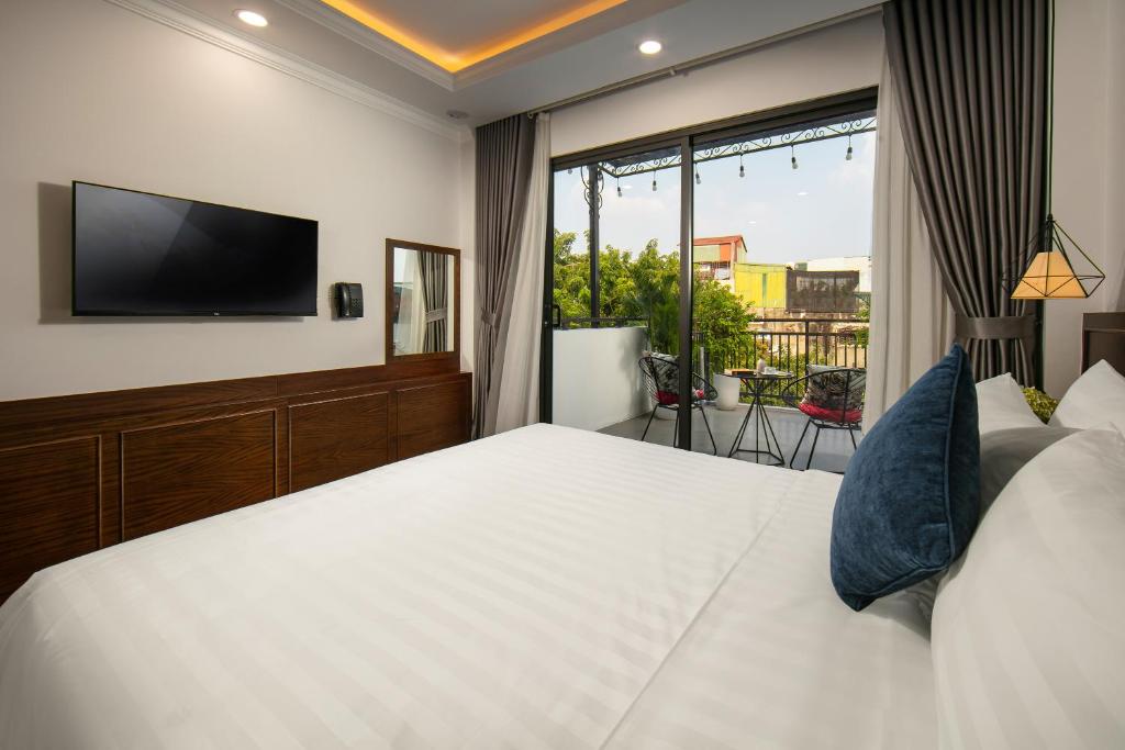 Postel nebo postele na pokoji v ubytování Hanoi Vacanza Premier Hotel