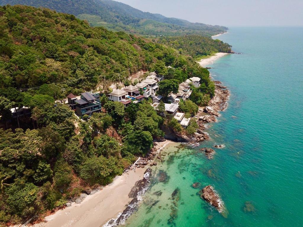 an aerial view of a beach with houses and the ocean at Cliff Lanta Suite-Koh Lanta Krabi in Ko Lanta