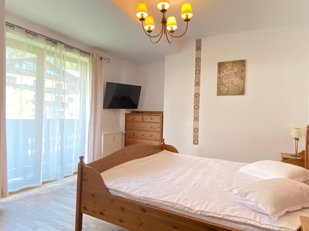 Postel nebo postele na pokoji v ubytování Predeal Escape Apartment