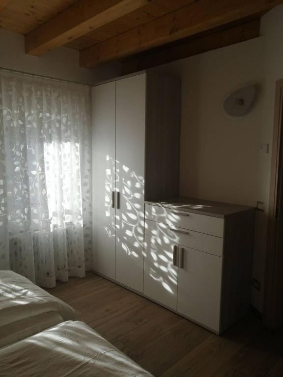 Postel nebo postele na pokoji v ubytování Cadore Luminoso appartamento