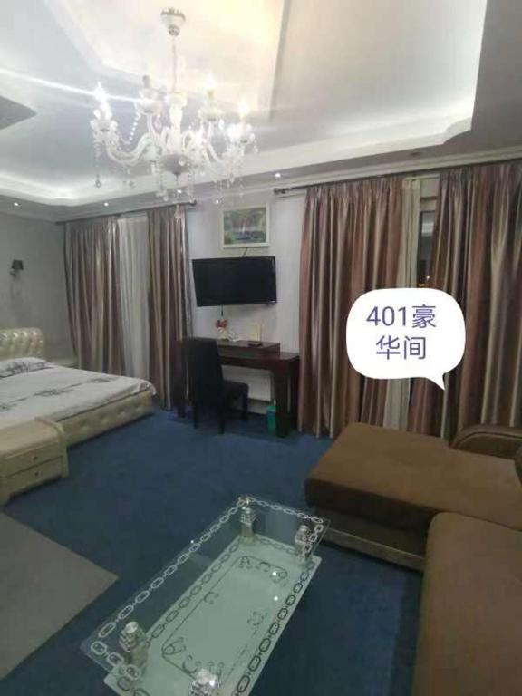 Postel nebo postele na pokoji v ubytování Great Wall hotel
