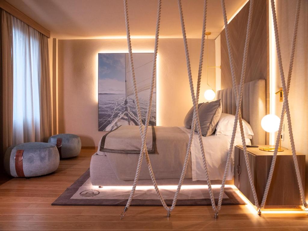 a bedroom with a swing bed in a room at Miramare Suites in Sestri Levante