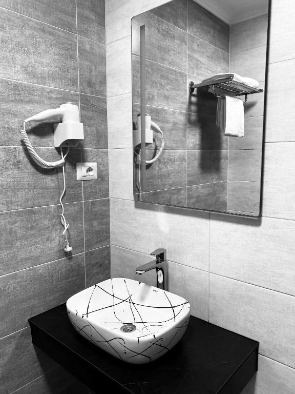 Koupelna v ubytování Hotel Callisto
