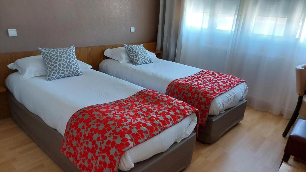 Postel nebo postele na pokoji v ubytování Hôtel Brun