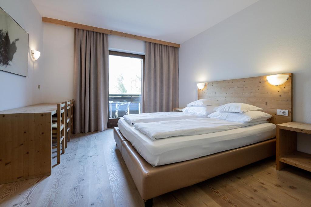 Postel nebo postele na pokoji v ubytování Rooms Kronblick