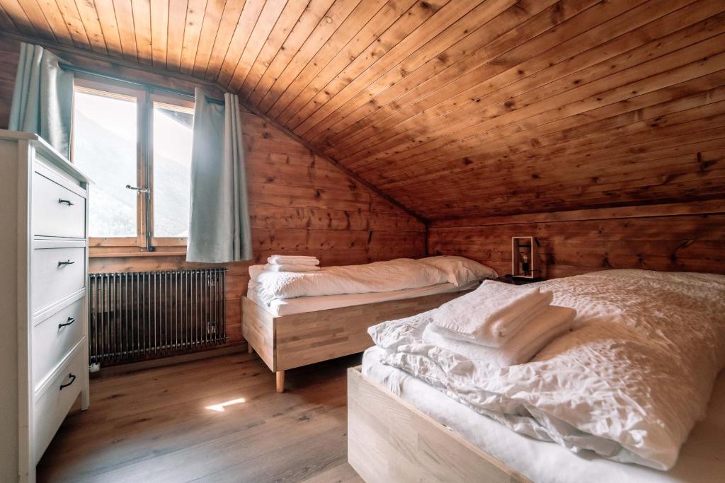 Postel nebo postele na pokoji v ubytování Hotel Les Amis