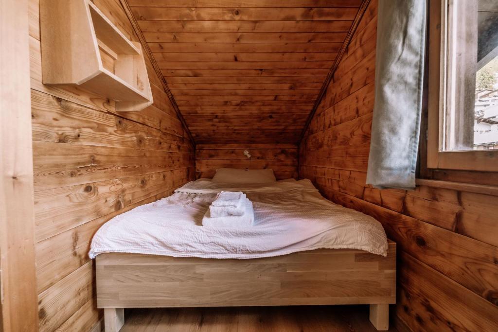 Postel nebo postele na pokoji v ubytování Hotel Les Amis