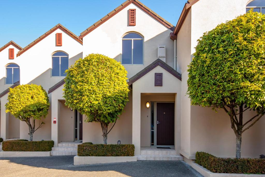 a house with trees in front of it at Midtown Tui Villa - Taupō Central Holiday Unit in Taupo