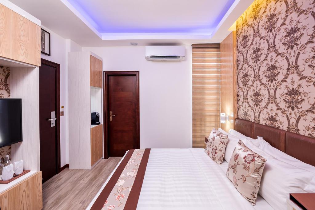 Postel nebo postele na pokoji v ubytování Summer Beach Maldives