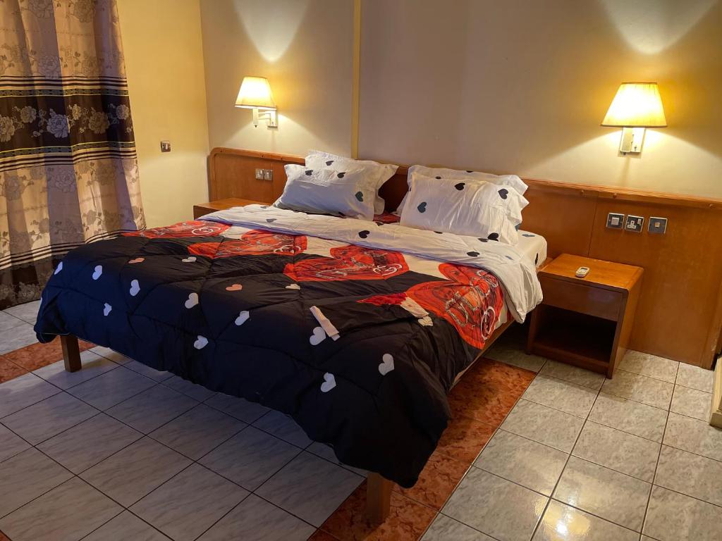 Postel nebo postele na pokoji v ubytování Maple Leaf Korean Hotel