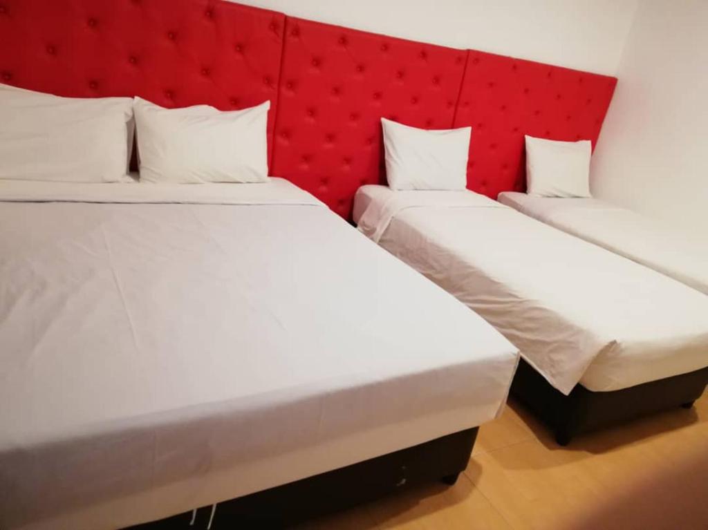Postel nebo postele na pokoji v ubytování SUNTEC HOTEL