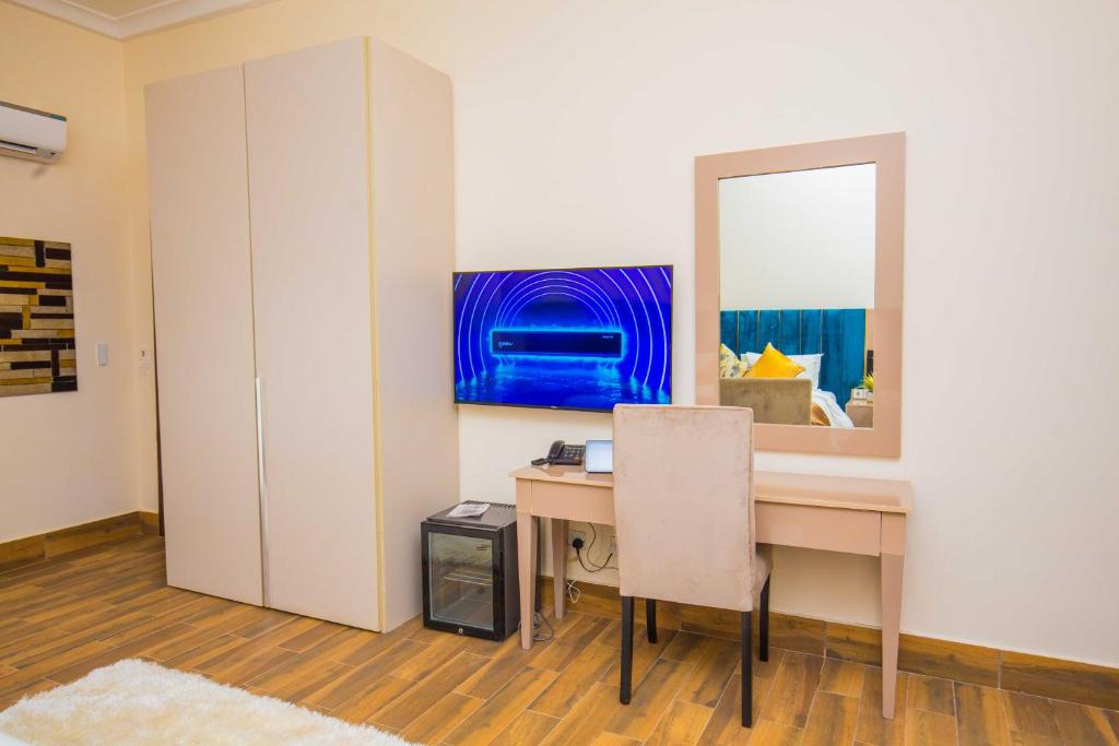 TV a/nebo společenská místnost v ubytování Qlets Privé