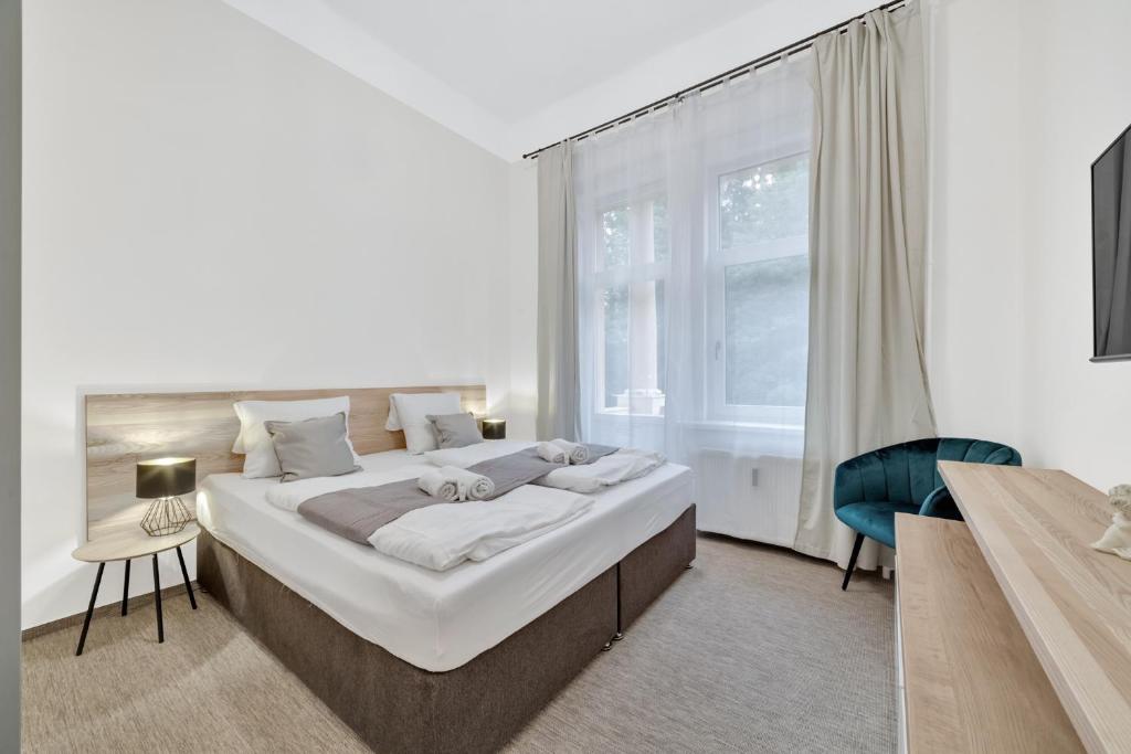 Postel nebo postele na pokoji v ubytování Rezidence Villa Gloria