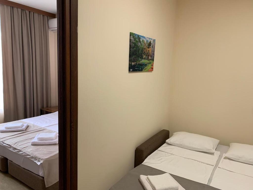 Postel nebo postele na pokoji v ubytování Villa Vitis