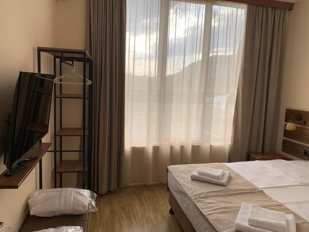 Postel nebo postele na pokoji v ubytování Villa Vitis