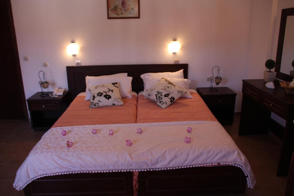 Postel nebo postele na pokoji v ubytování Joy Hotel