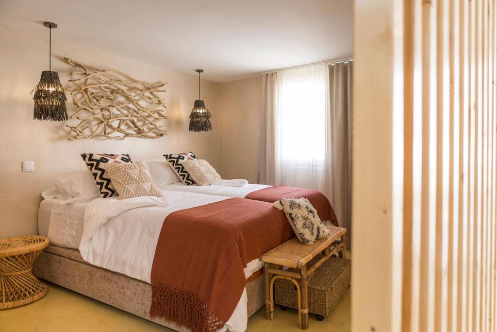 a bedroom with a large bed and a window at Sea'Ya Thoughtful Stays - Villas in Cascais