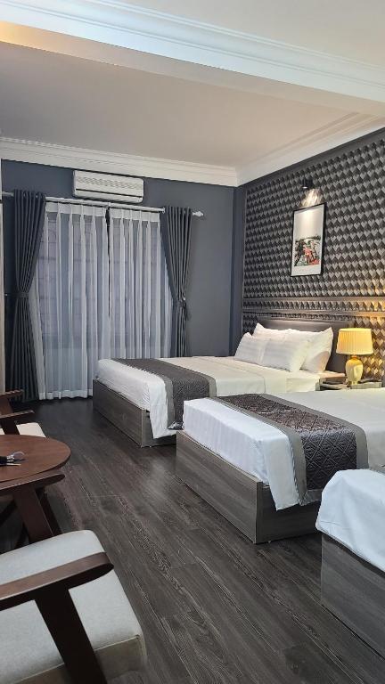 Postel nebo postele na pokoji v ubytování Hanoi Lucky Hostel