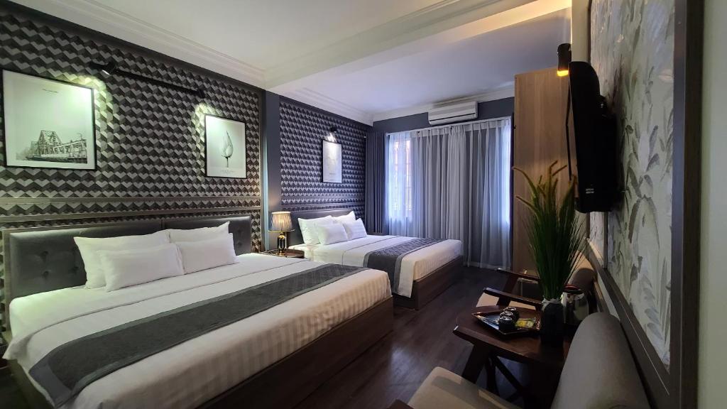 Postel nebo postele na pokoji v ubytování Hanoi Lucky Hostel