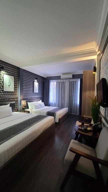 Postel nebo postele na pokoji v ubytování Hanoi Lucky Hostel