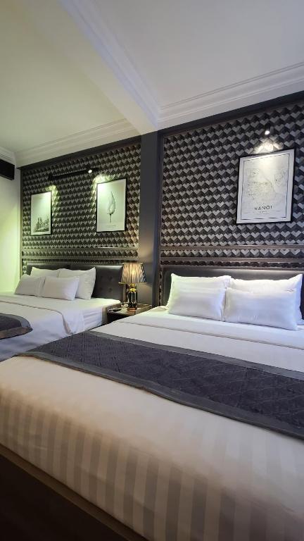 Postel nebo postele na pokoji v ubytování Hanoi Lucky Hostel
