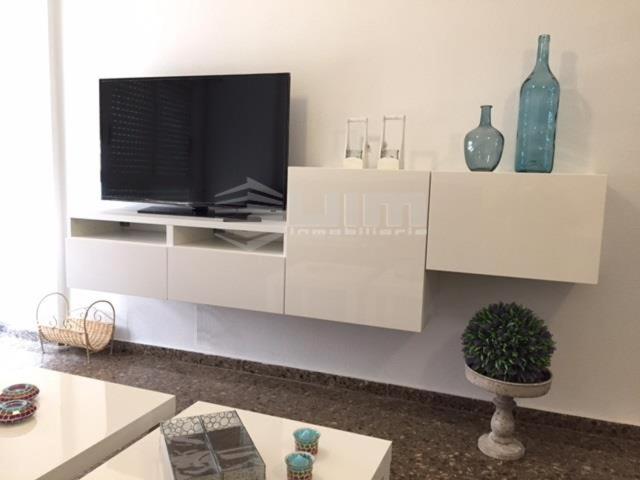A television and/or entertainment centre at UIM Mediterraneo Claveles Wifi