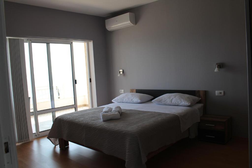 Posteľ alebo postele v izbe v ubytovaní Beachside Apartments Znjan