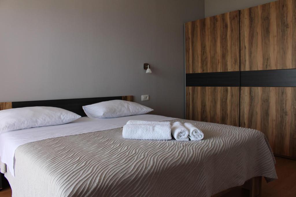 Posteľ alebo postele v izbe v ubytovaní Beachside Apartments Znjan
