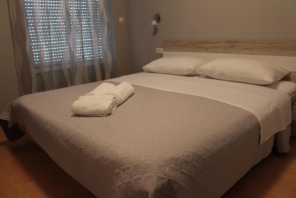 Posteľ alebo postele v izbe v ubytovaní Beachside Apartments Znjan