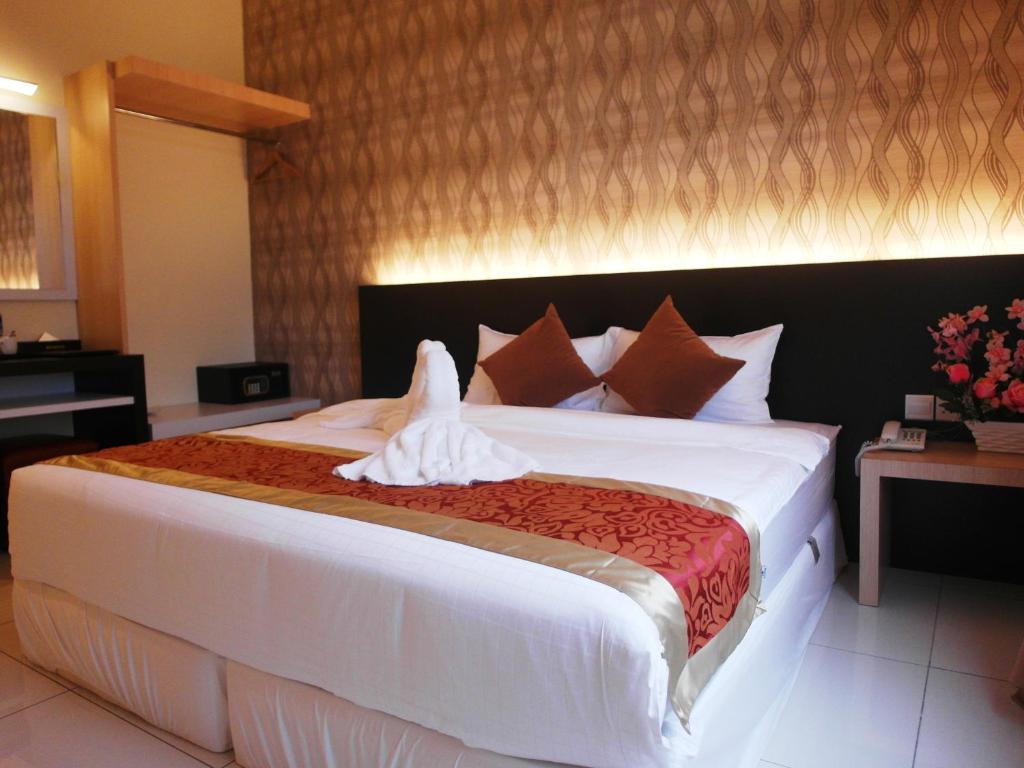 Postel nebo postele na pokoji v ubytování Supreme Hotel