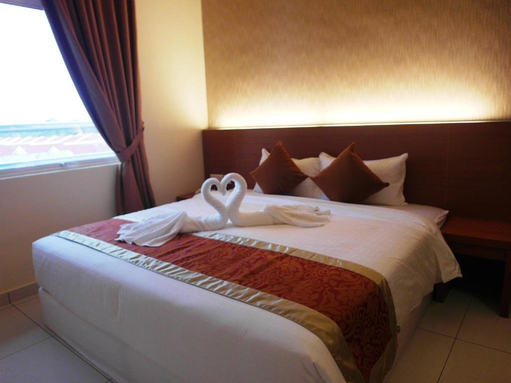 Postel nebo postele na pokoji v ubytování Supreme Hotel