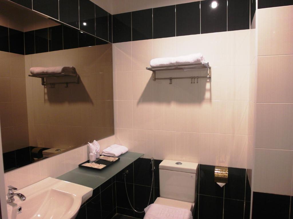 Koupelna v ubytování Supreme Hotel