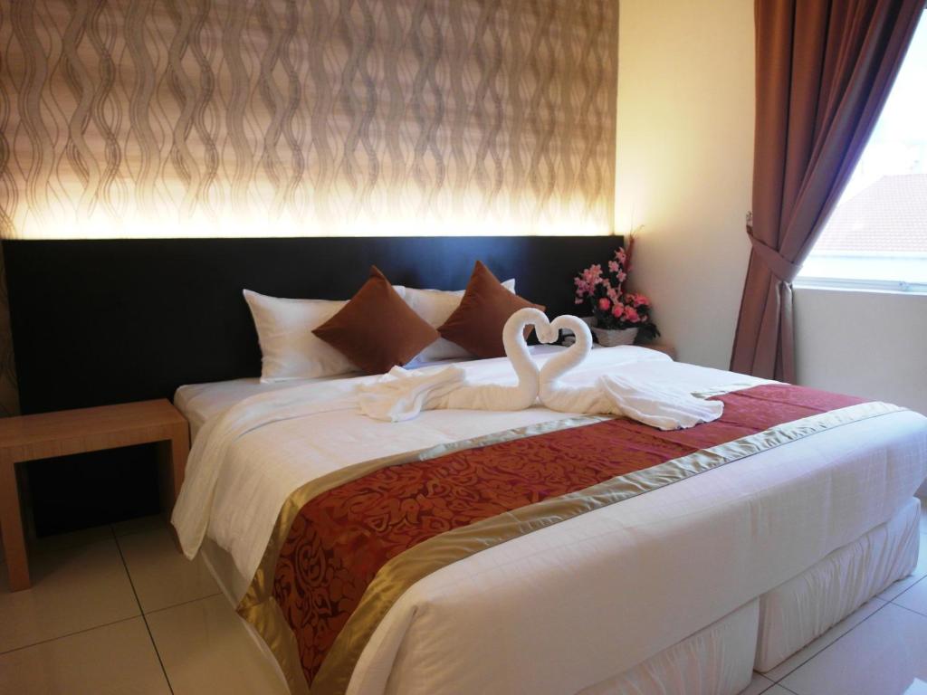 Postel nebo postele na pokoji v ubytování Supreme Hotel