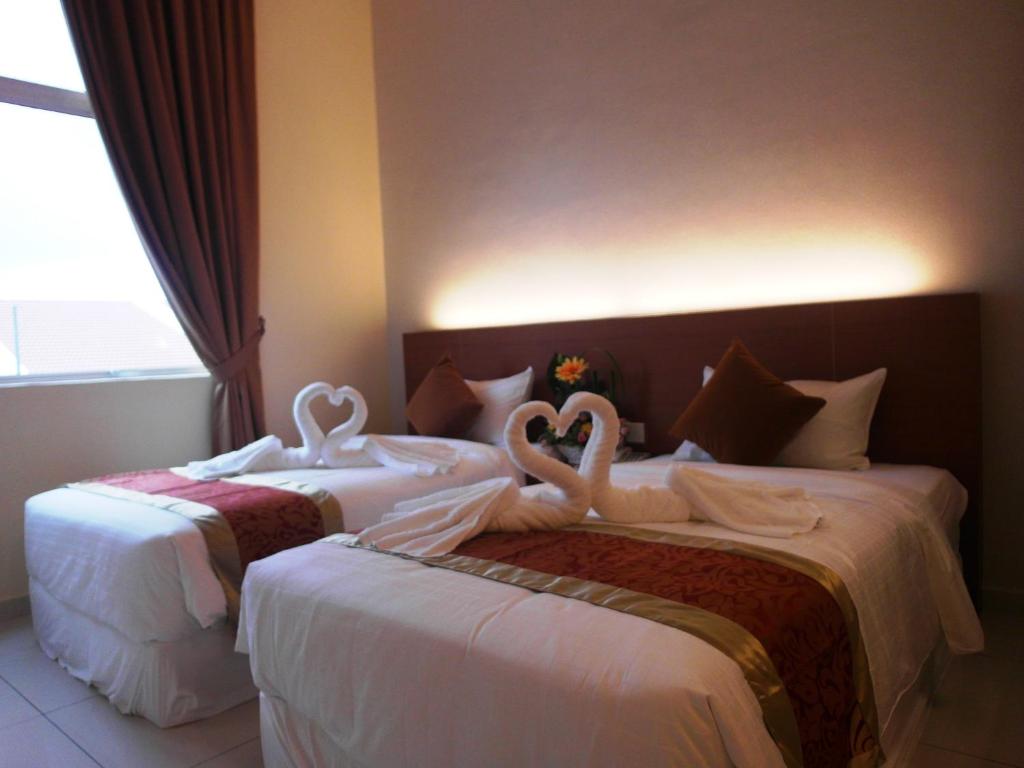Postel nebo postele na pokoji v ubytování Supreme Hotel