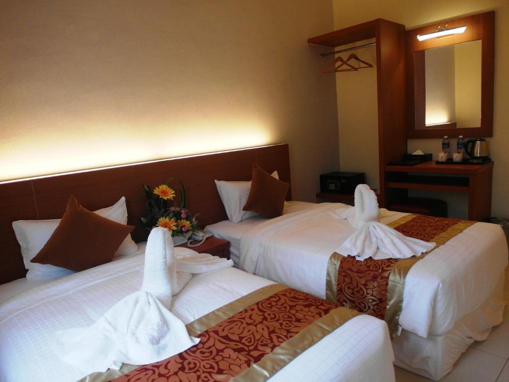 Postel nebo postele na pokoji v ubytování Supreme Hotel