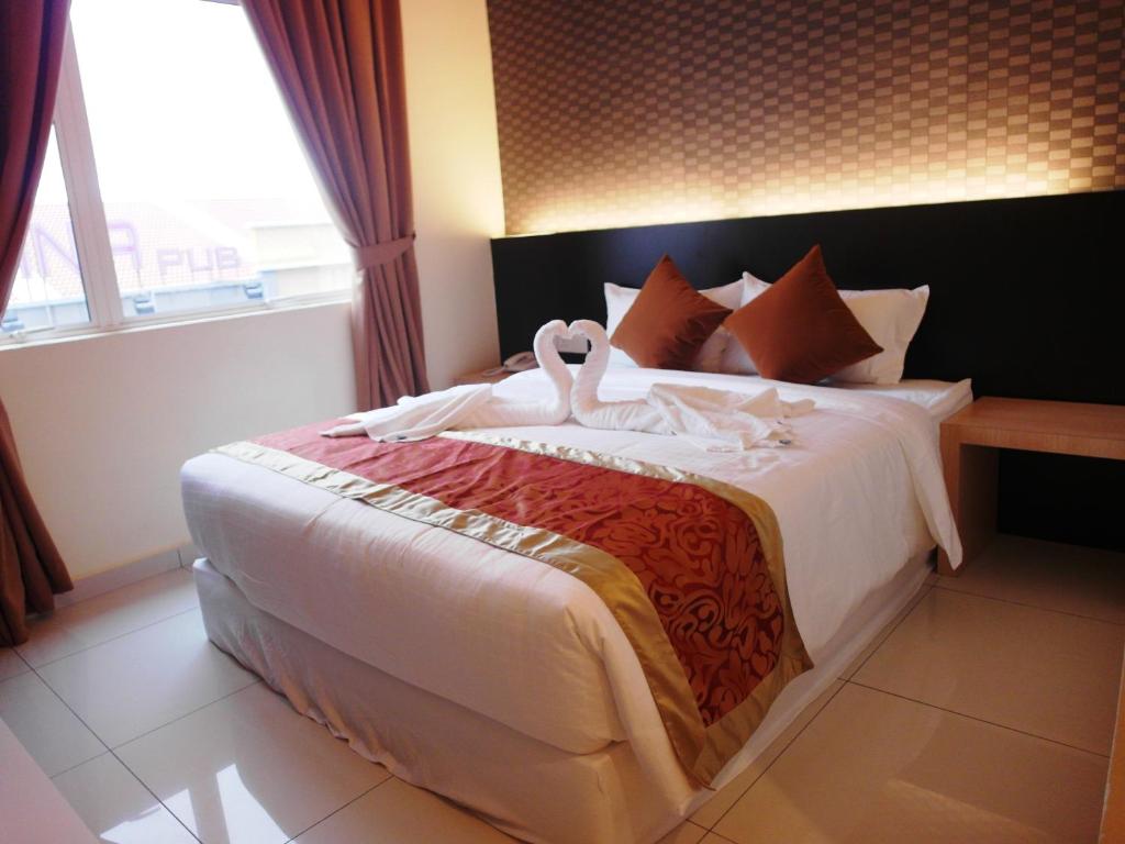 Postel nebo postele na pokoji v ubytování Supreme Hotel