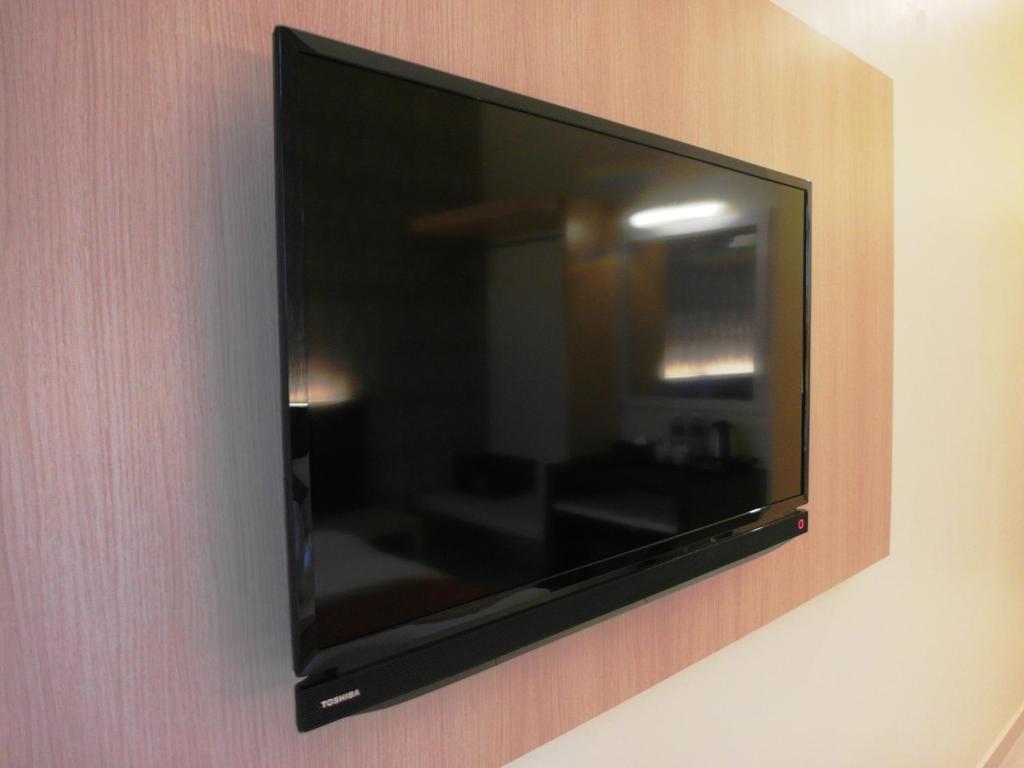 TV a/nebo společenská místnost v ubytování Supreme Hotel