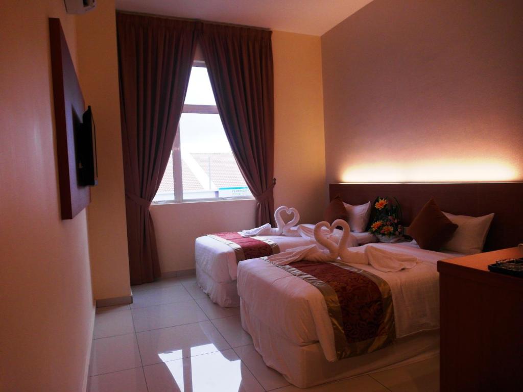 Postel nebo postele na pokoji v ubytování Supreme Hotel