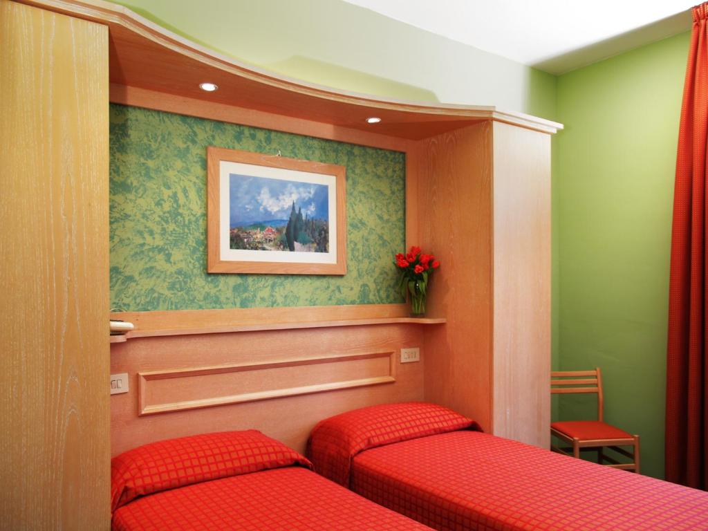 Postel nebo postele na pokoji v ubytování Hotel Meridiana