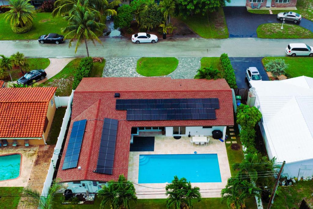 an aerial view of a house with solar panels on it at Bahama Breeze in Fort Lauderdale