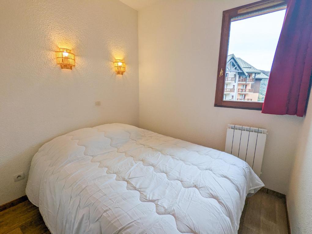 Posteľ alebo postele v izbe v ubytovaní Appartement 2/4 pers, Résidence 4* Les Hauts de Valmeinier, Centre station