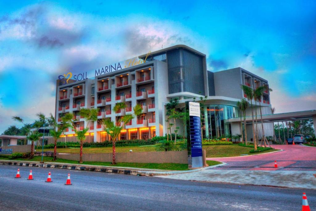 a hotel with orange traffic cones in front of it at Soll Marina Hotel & Conference Center Bangka in Pangkal Pinang