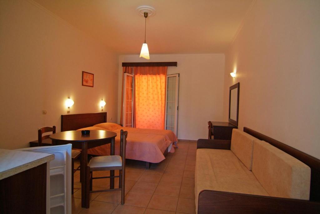 Postel nebo postele na pokoji v ubytování Joy Hotel