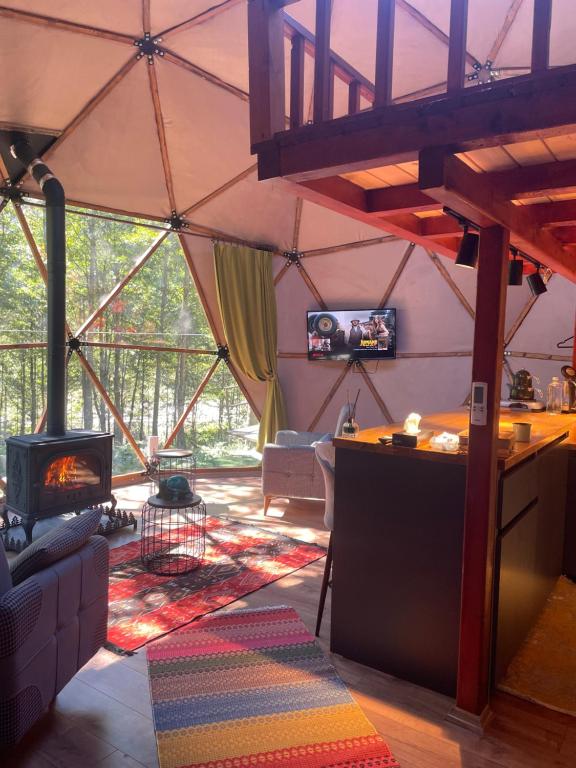 a living room with a tent with a fireplace at Ayder Freedome in Ayder Yaylasi