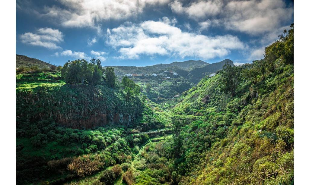 a view of a valley in a mountain range at Camino Art House in Vega de San Mateo