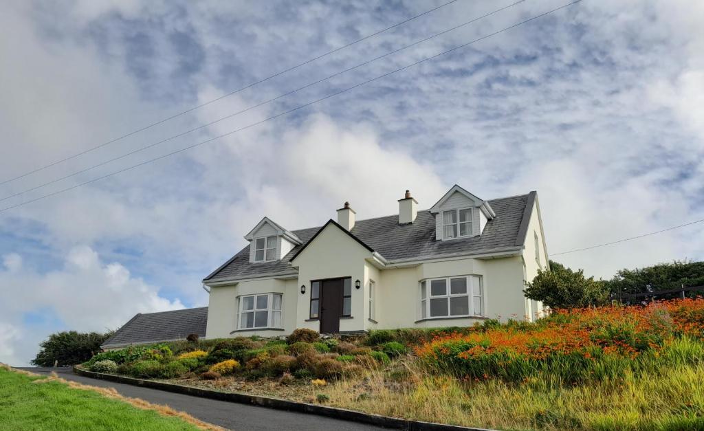 a white house on top of a hill at Hilltop Haven, Doolin in Doolin