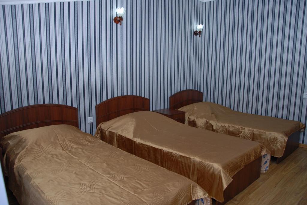 Voodi või voodid majutusasutuse Hotel Exotica toas